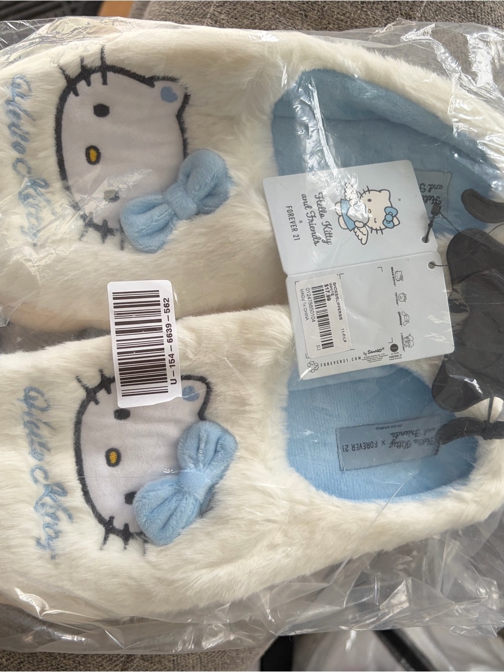 Forever 21 Hello Kitty Cream Faux Fur Slippers with Light Blue Accents